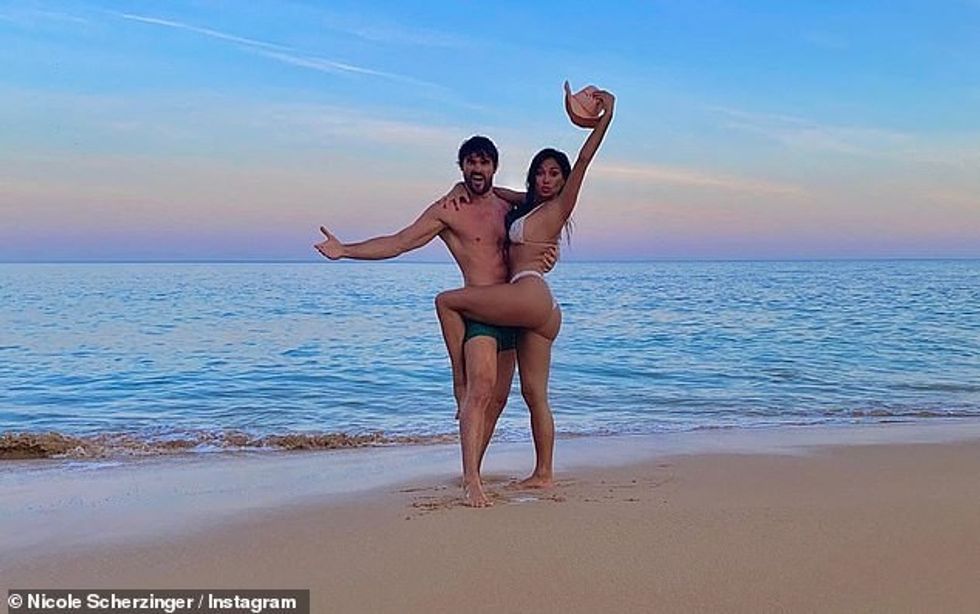 30435580 8493345 Bikini clad Nicole Scherzinger leaps into boyfriend Thom Evans s a 10 1594019335657