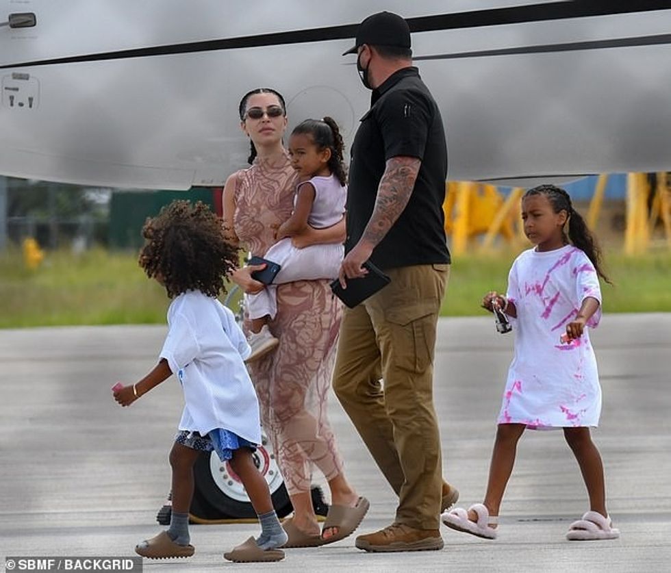 31747872 8609663 Family first As she carried her youngest daughter the 39 year ol m 54 1596996768586