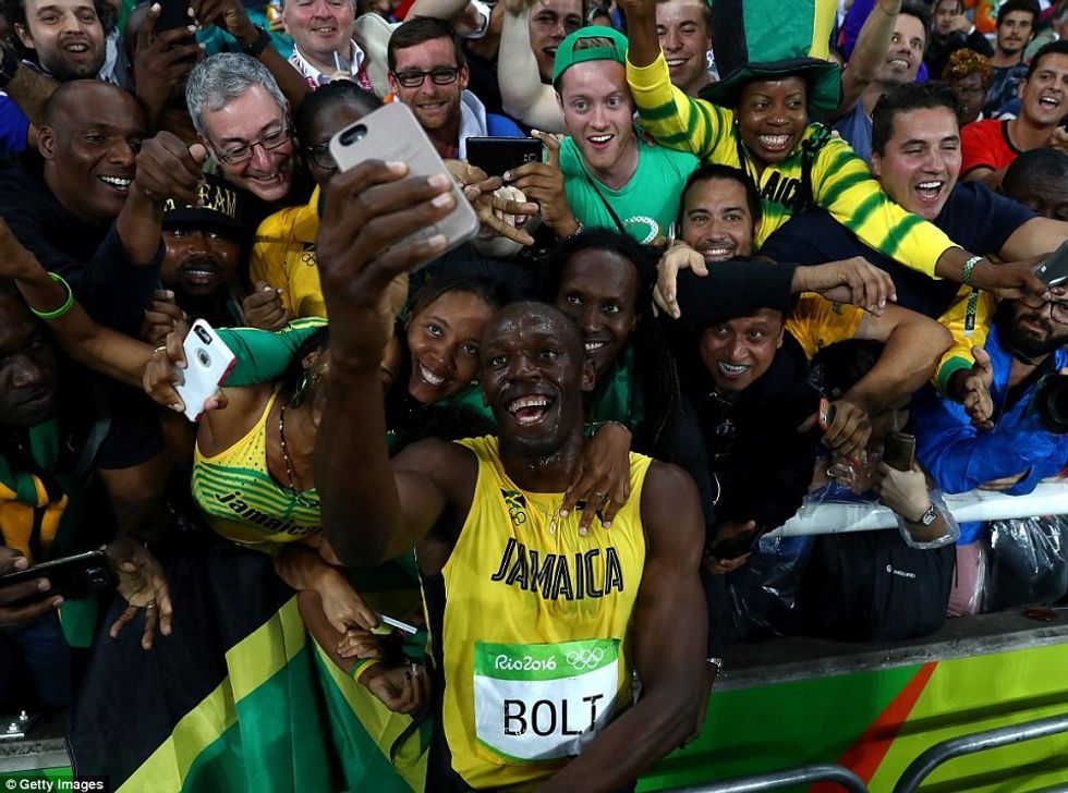 3761DAB900000578-0-Bolt_cupped_his_ear_and_laughed_as_the_crowd_chanted_his_name_an-m-57_1471595227046