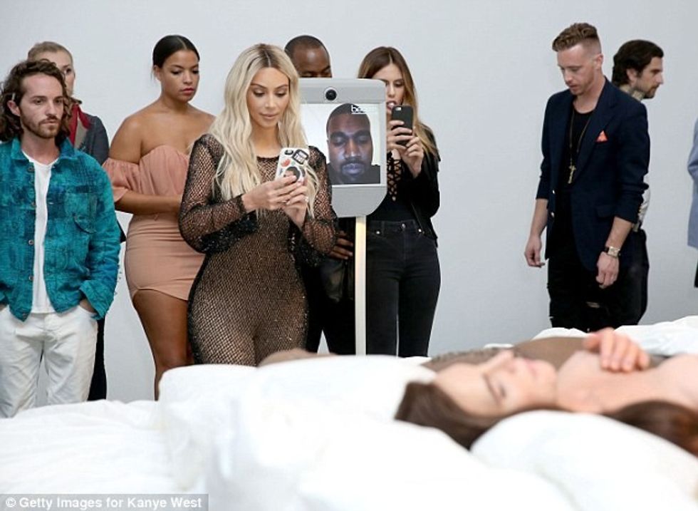 37A1801B00000578-0-Kanye_watched_from_a_video_screen_as_he_prepared_for_a_show_on_h-a-160_1472760613844