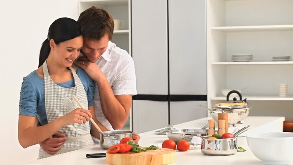 385197498 kitchen apron kitchen counter saucepan tomato vegetables