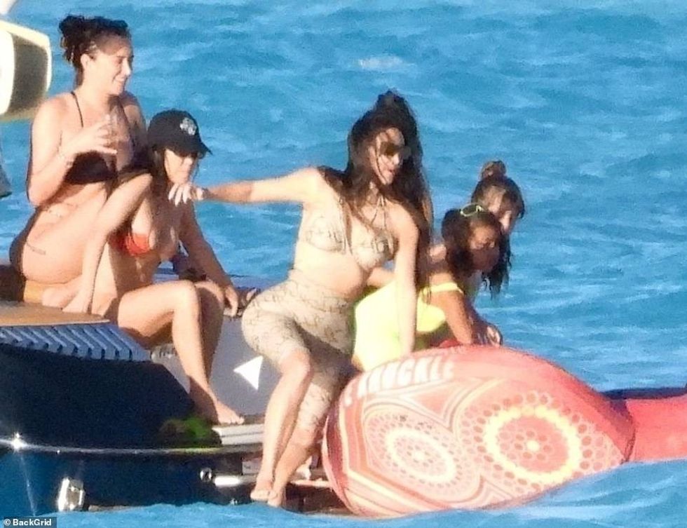 38685552 9206267 Snake queen The 40 year old dressed her signature curves in a ba a 135 1612067907894