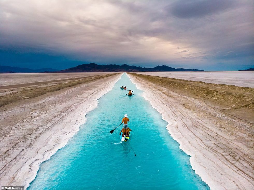 42099390 9499899 A salt mining canal filled with crystal blue water has become Ut a 94 1619127659338