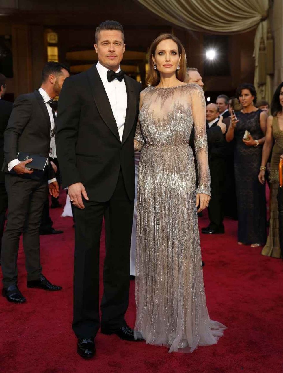 441090 actors brad pitt and angelina jolie wearing a silver elie saab gown ar