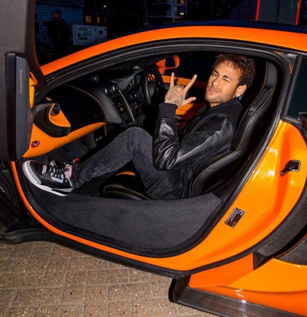 48F9A2BC00000578 5364059 The Brazilian arrived in style pulling up in an orange supercar m 73 1518045367398