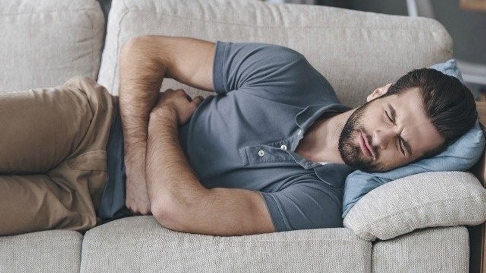 509006 stomach pain men man afp relax news