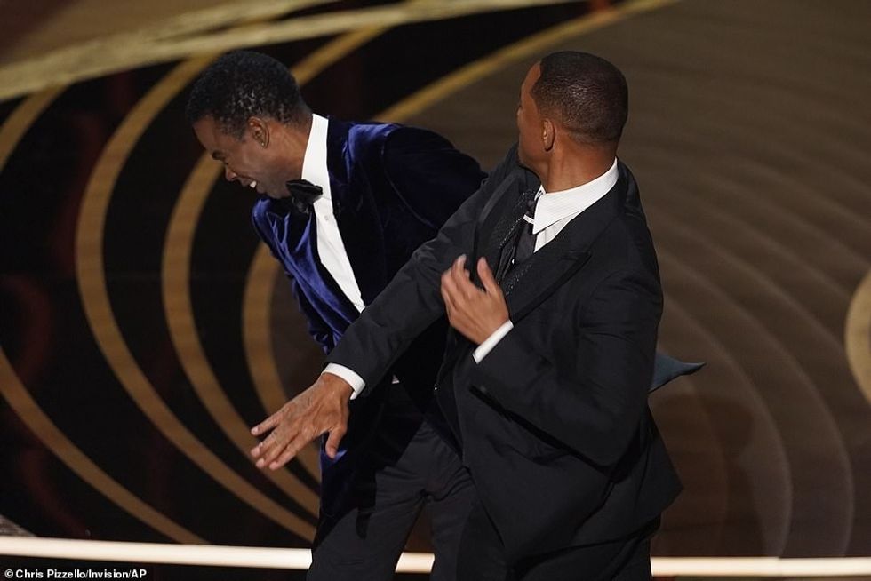 55905003 10670195 Will Smith slapped Chris Rock onstage at the Oscars Sunday after a 8 1648687256217