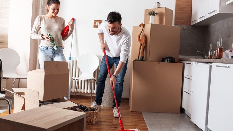 2024/01/couple-moving-in-with-boxes-and-mopping-123.jpg