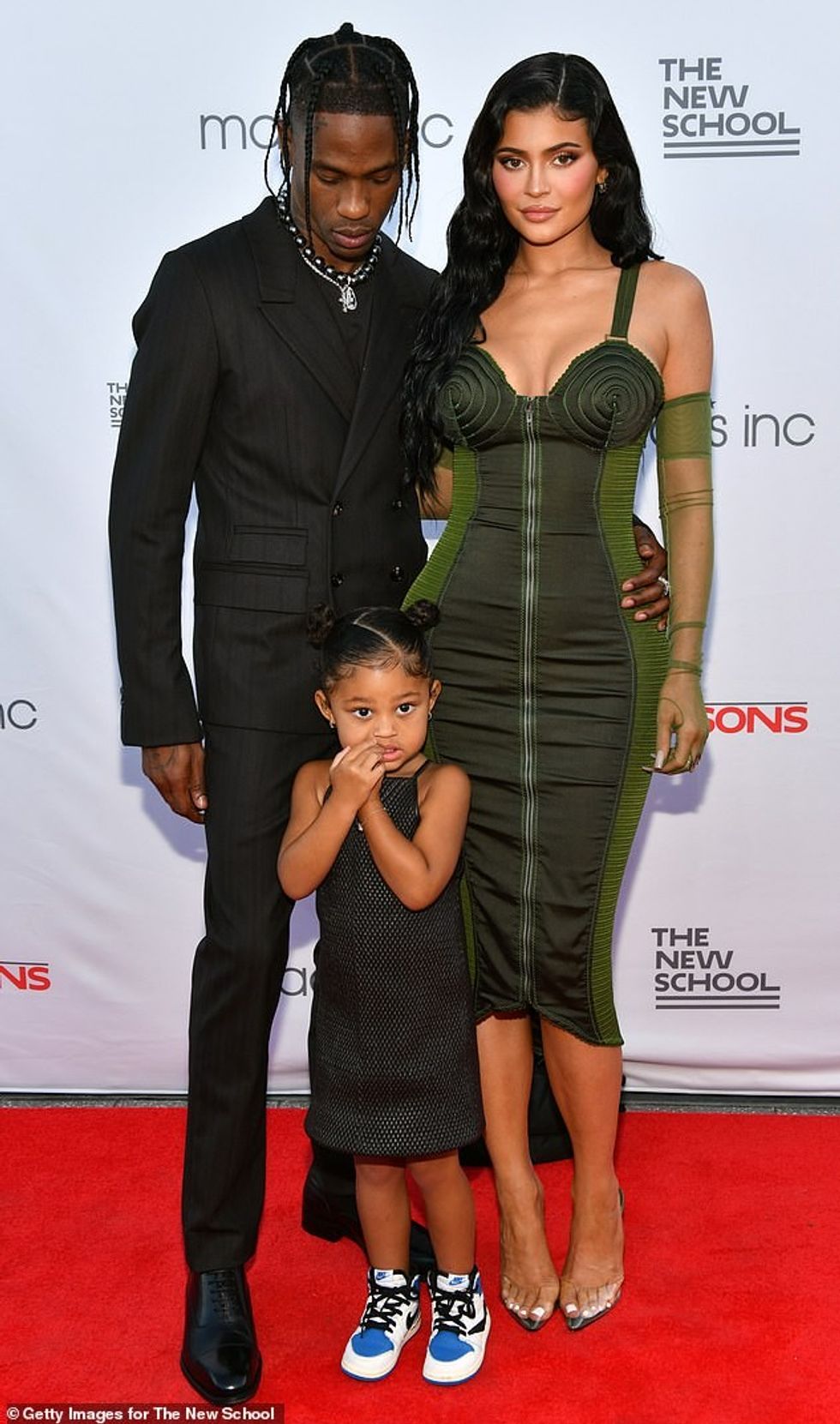 56669023 10723429 Family of three Kylie Travis and daughter Stormi posed on a red a 14 1650081817314