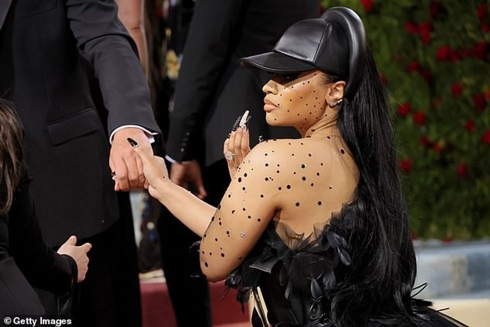 57330317 10776999 Sleek Her long black tresses were worn in a sleek style and casc a 161 1651550300305