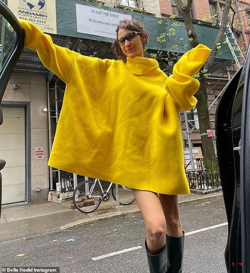58153601 10843985 Rainy day In another share she rocked a yellow poncho and lightl a 98 1653280626337