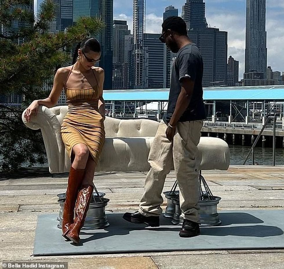 58153615 10843985 What she does best Bella sat modeling on an artistic couch in on a 6 1653309215639