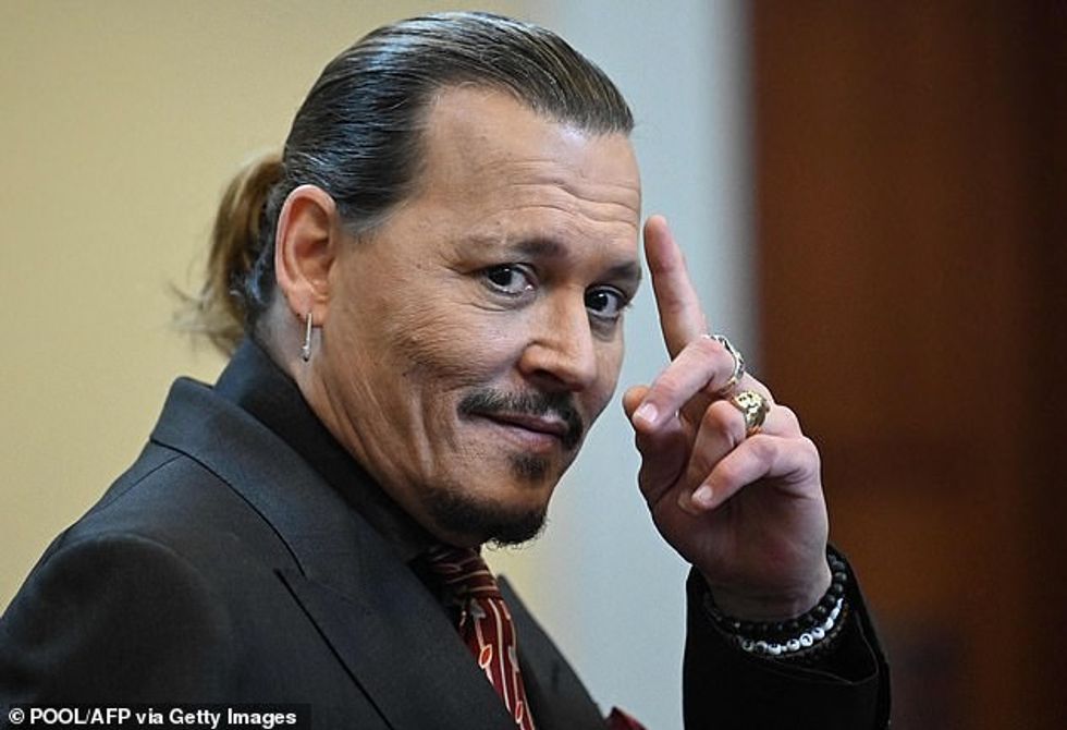 59573209 11502085 Depp s legal team has also filed to appeal the 2million he was o m 12 1670207189571
