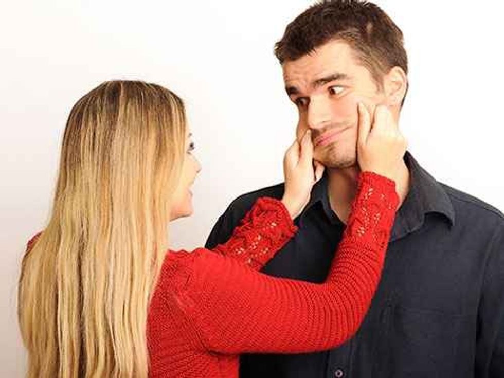 6 woman squeezing cheeks lgn 62919452