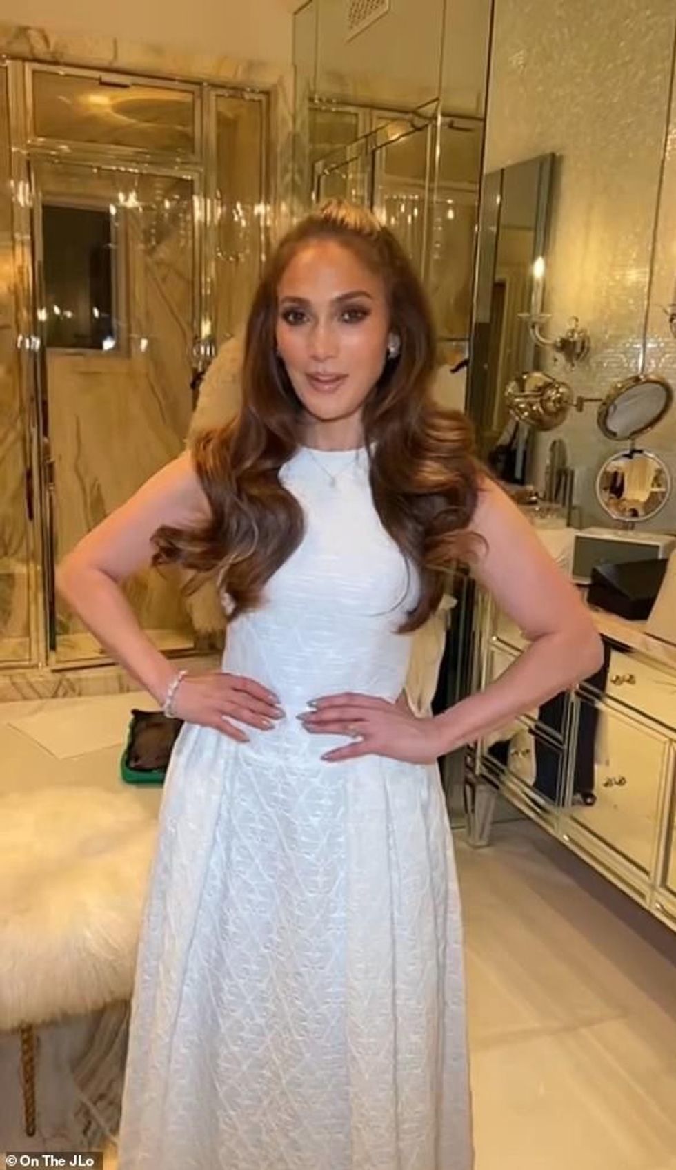 60377915 9793997 Blushing bride JLo wore a quaint white dress in video posted to a 4 1658108351303