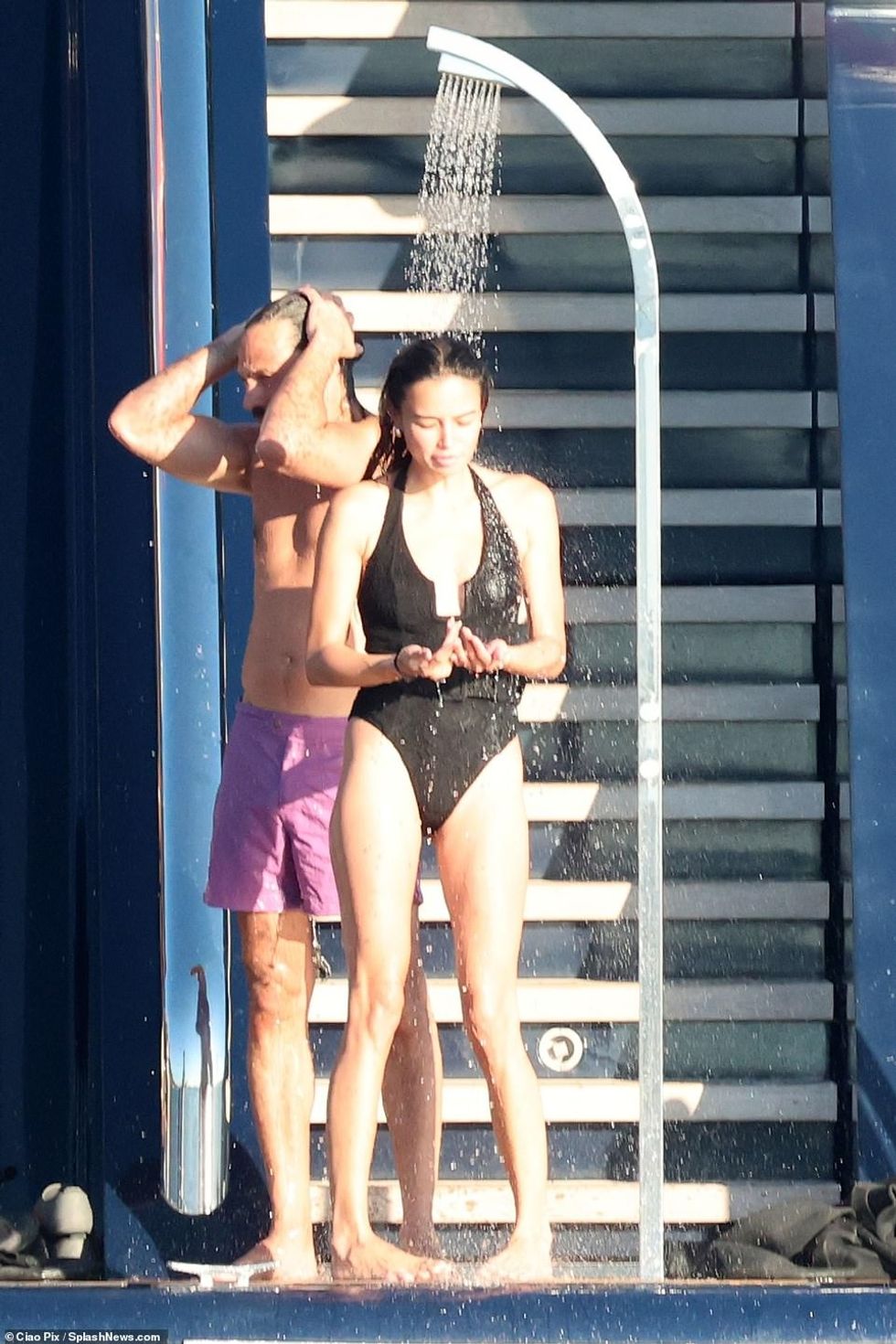 60990589 11073889 Quick rinse She rinsed off the sea water with the yacht s outdoo a 88 1659466008207