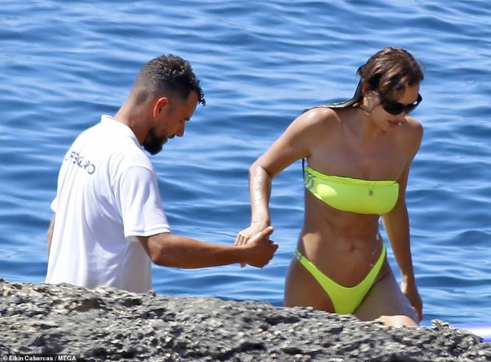 61096455 11083915 Helping hand Following her dip in the sea Irina was given a help a 37 1659689645533