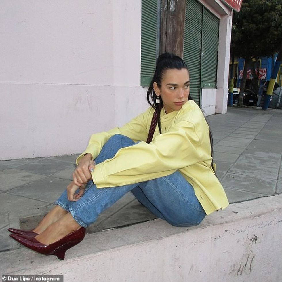 62397031 11211359 Curb appeal She also posed in a yellow leather shirt and jeans a a 36 1663156901378