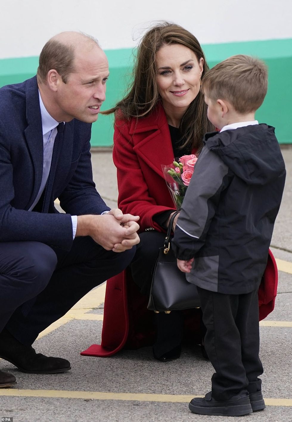 62841369 11254241 Both the Prince and Princess of Wales crouched down to speak to m 17 1664281845744