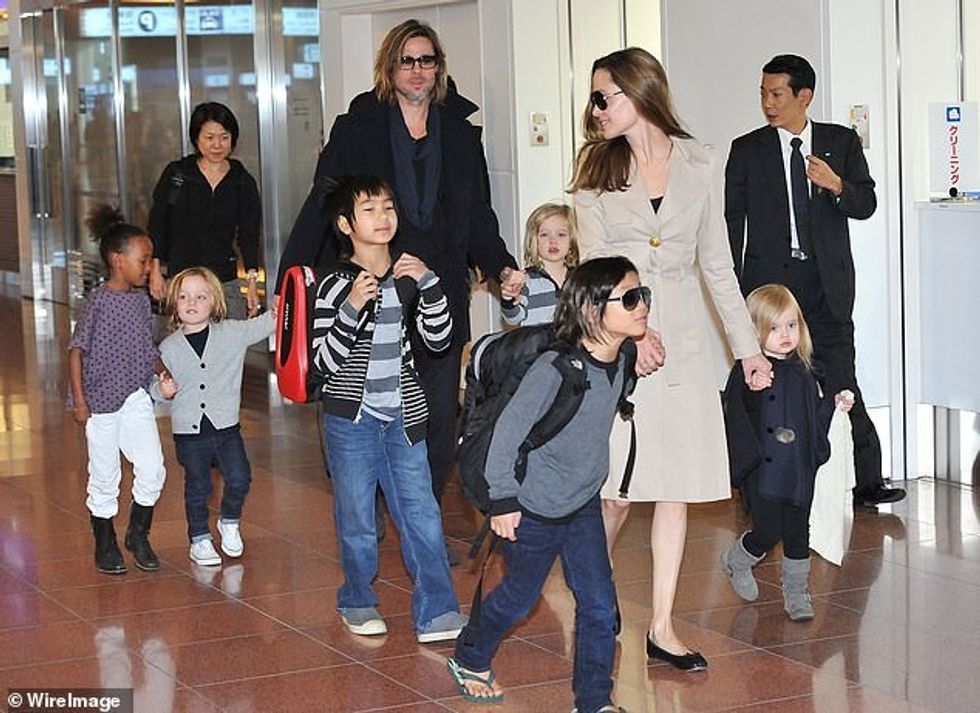 63117531 0 Angelina Jolie and Brad Pitt are pictured in November 2008 with a 1 1664984303175