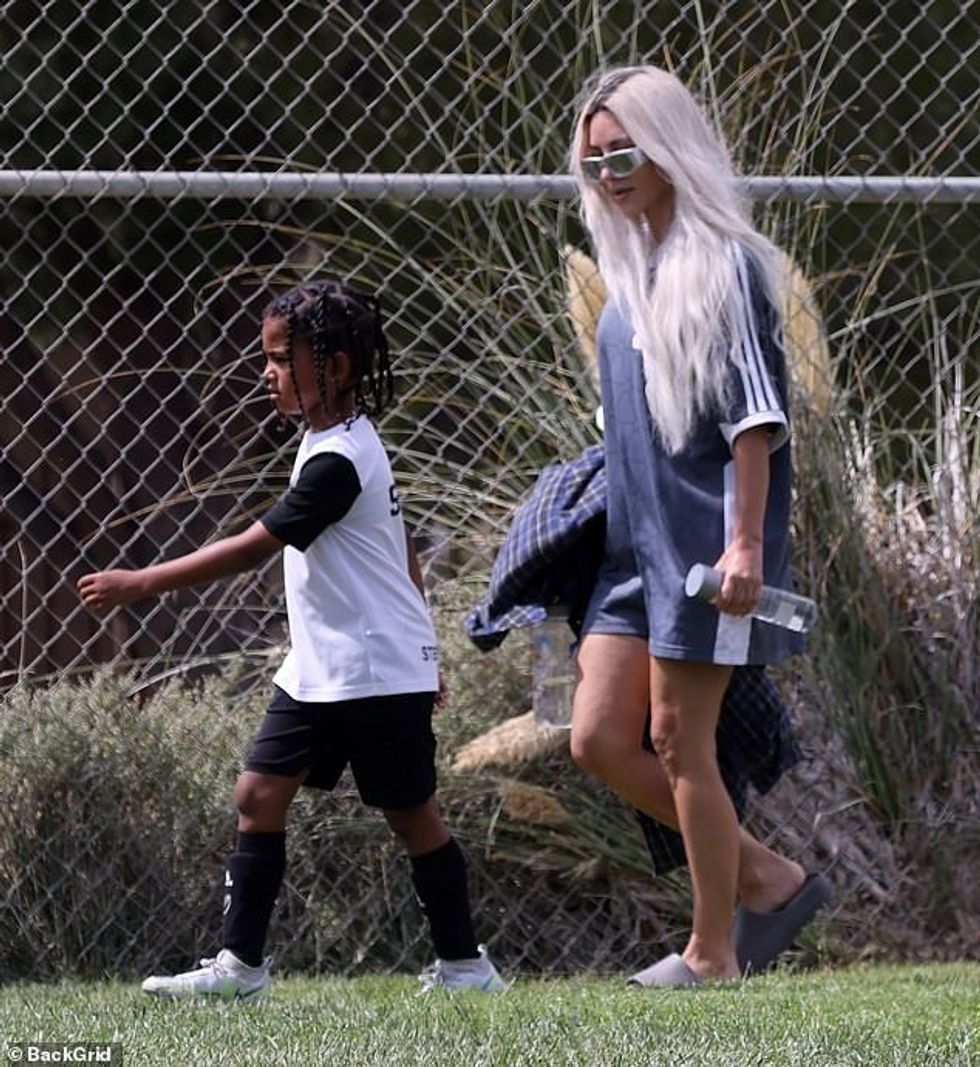 63195501 11288905 On the go After the game she gathered her belonging as she walke a 8 1665095136584