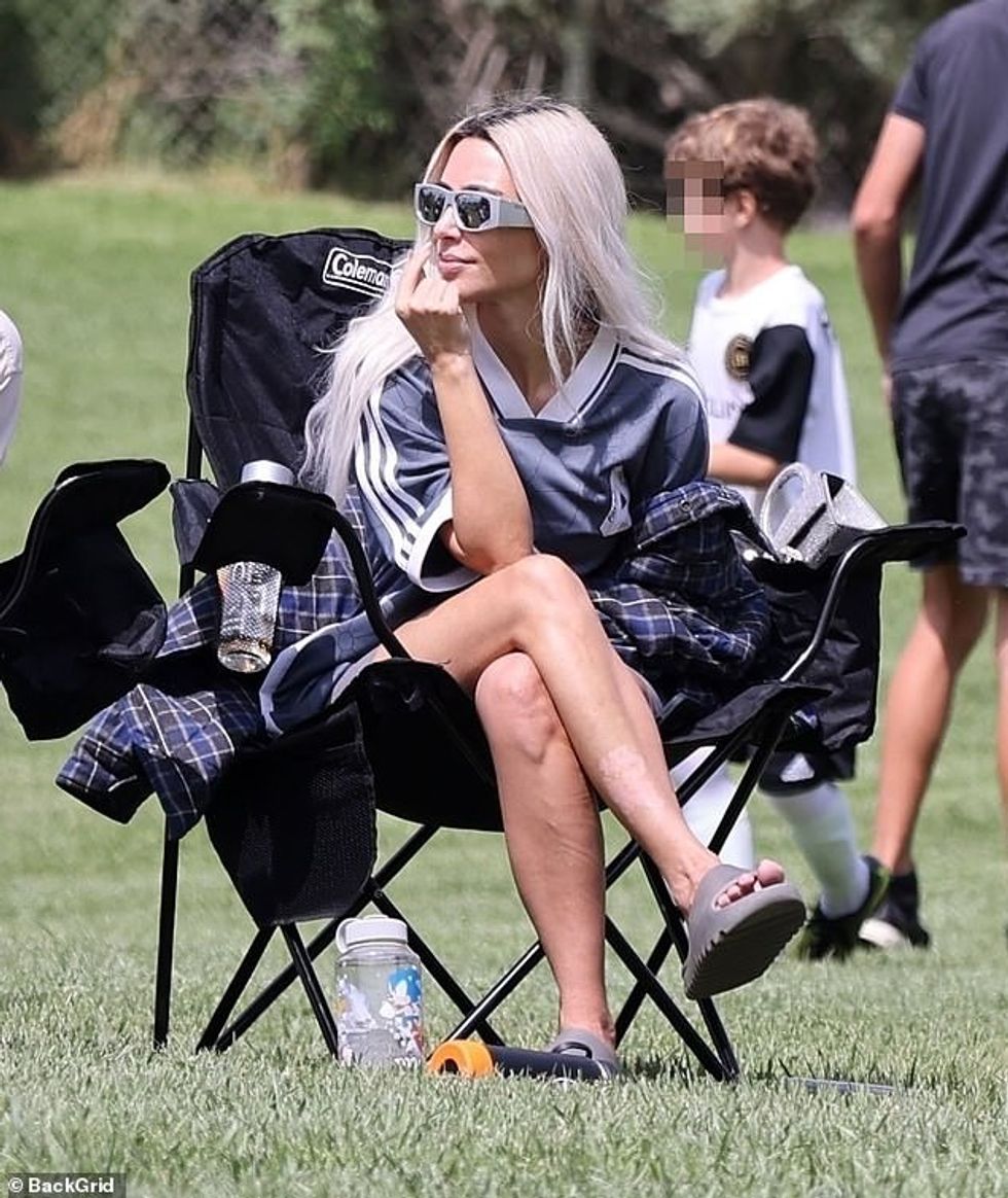 63195525 11288905 Support system She cheered for her eldest son as she sat on the a 7 1665095136583