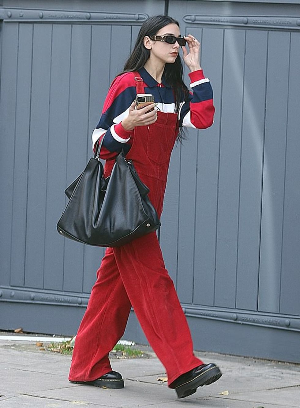 63303181 11299343 Looking good Dua Lipa cut a casual figure in a pair of bold red a 64 1665408153896