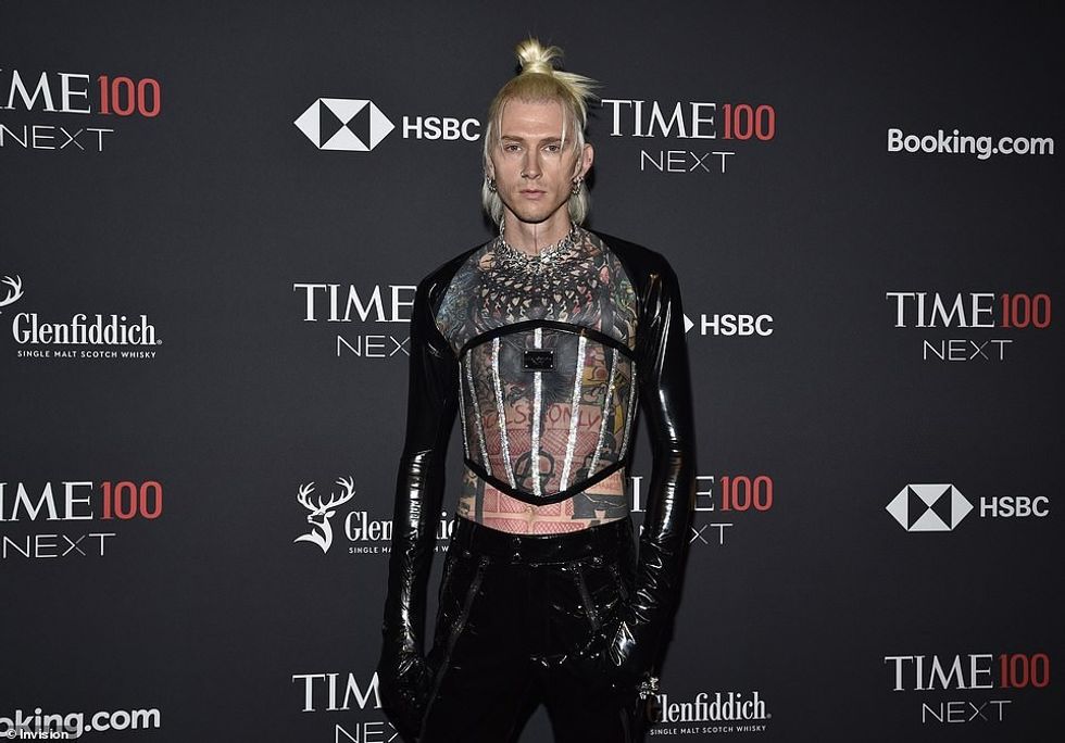 63854641 11355237 Edgy The rapper who displayed his extensive ink collection acros a 39 1666763571708