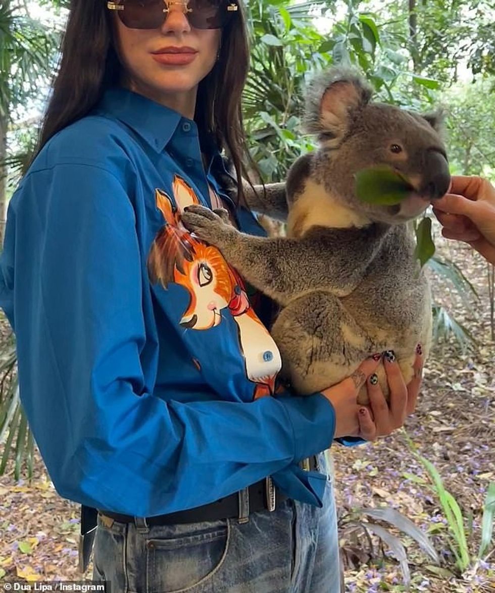 64217267 11393091 Dressed for the occasion she sported an electric blue shirt with a 18 1667637551324