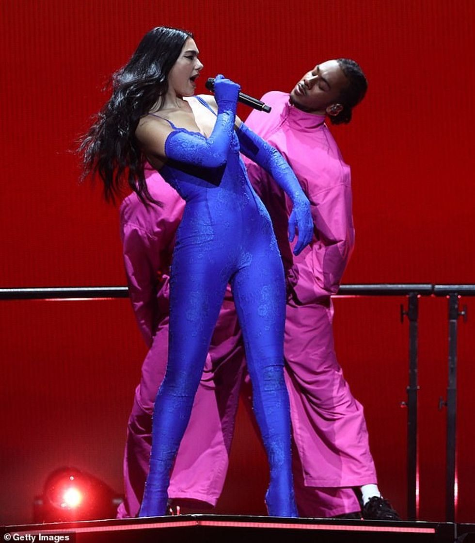 64312647 11403611 Dancers Dua was surrounded by a troupe of dancers decked out in m 35 1667918360222