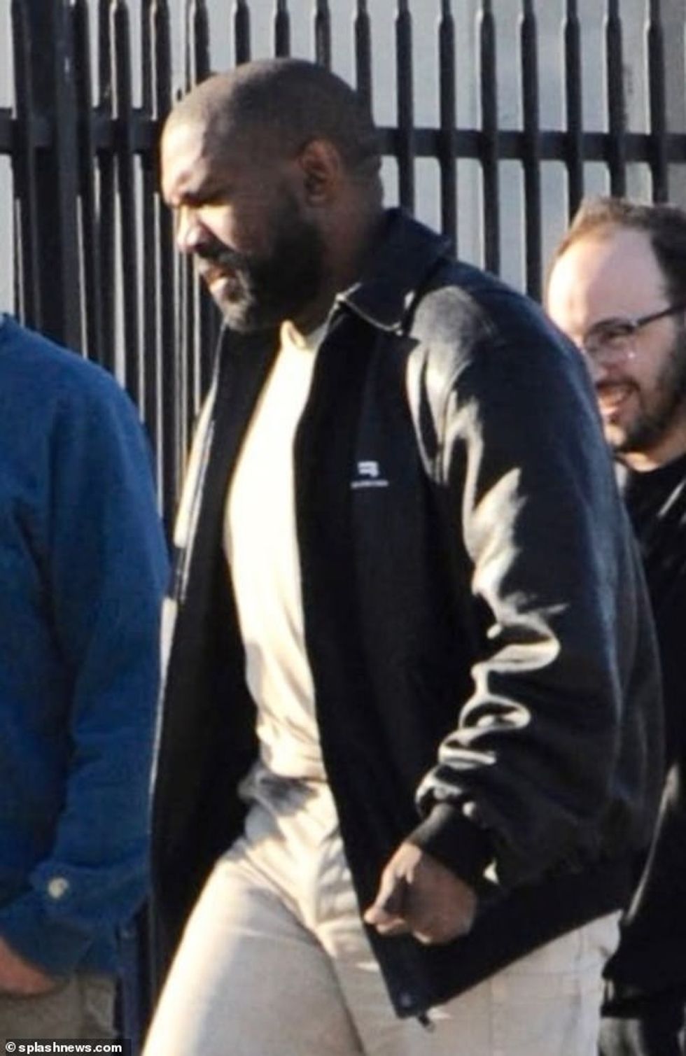 64430503 11415321 Simple West wore his nondescript black jacket open to reveal a w a 94 1668137190208