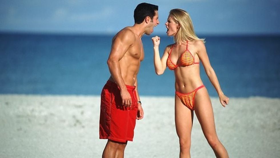 646462 couple argue beach