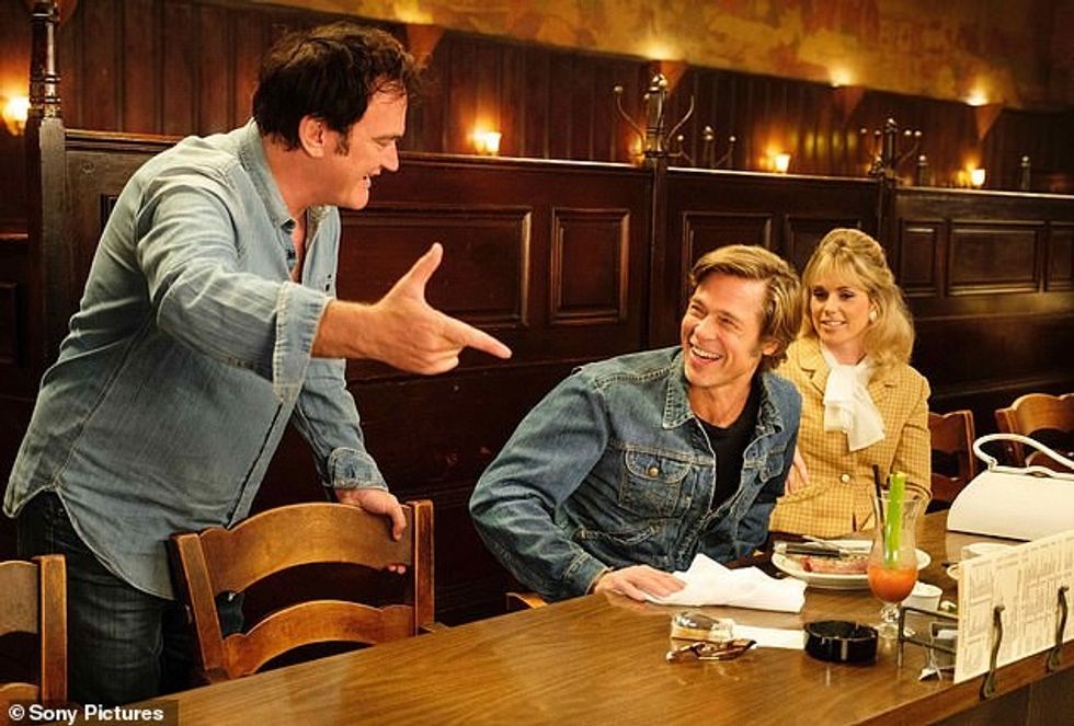 64701753 11444823 Doing his thing Seen on set with Brad Pitt and a costar in Once a 17 1668795894549