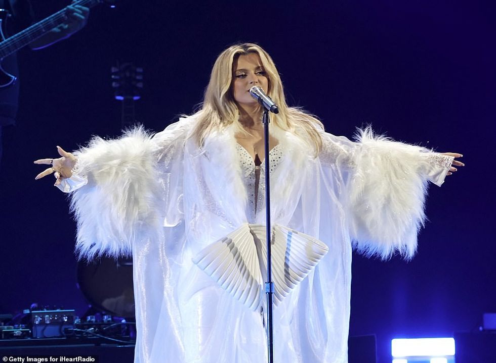 65198031 11497639 Bow tiful Her robe was adorned with a large faux leather bow a 71 1670054434391