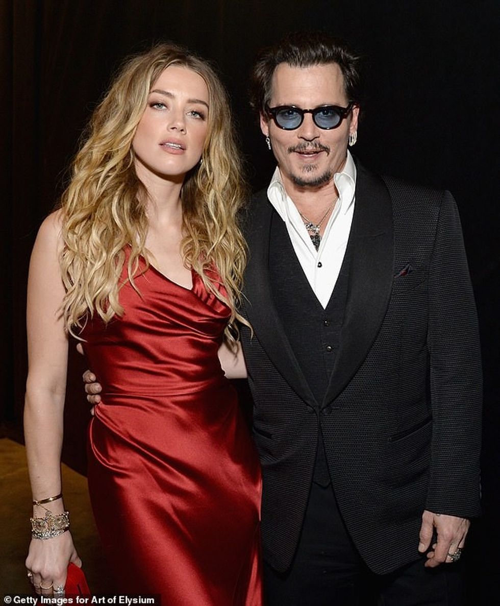 65733255 12202687 Johnny Depp and ex wife Amber Heard have finally settled their d a 131 1686916277607