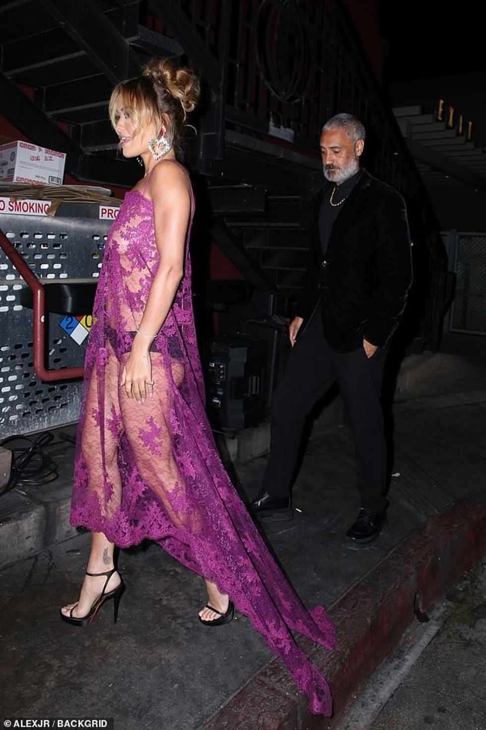 66347959 11613621 Earrings She wore her huge diamond earrings styled in a heart sh a 30 1673242935993