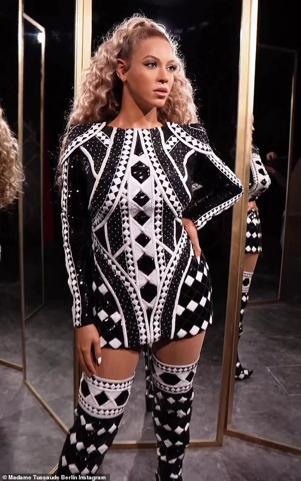 67058339 11685879 Stylish They also accessorized her figure with several earrings a 3 1674879498165