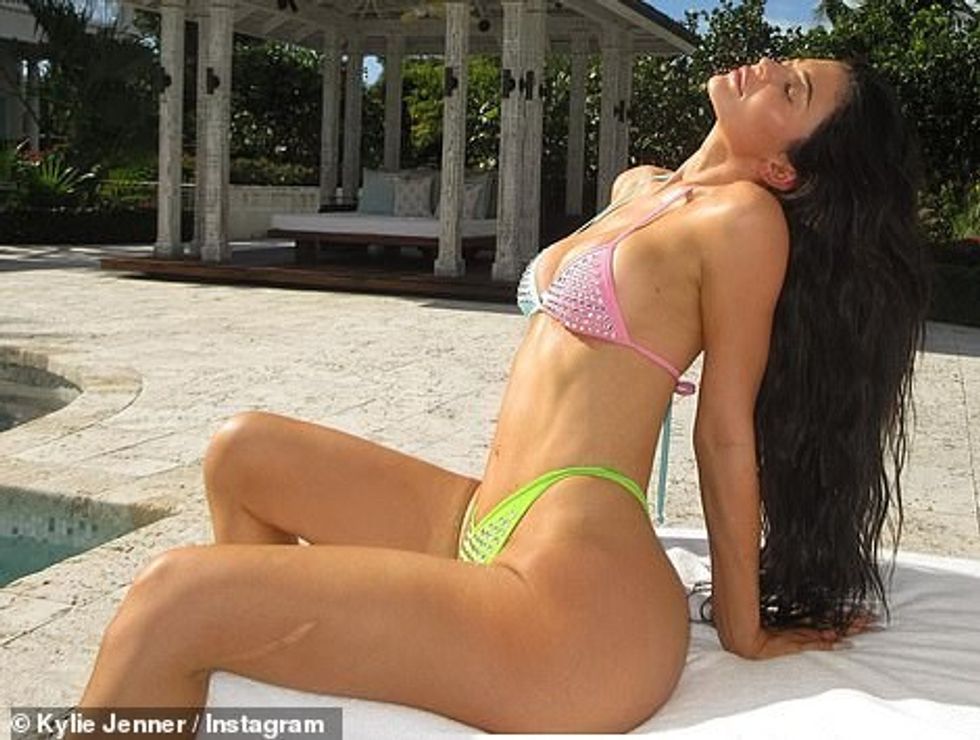 67330601 11714129 Baring some skin Kylie Jenner bared quite a bit of skin in a tin a 26 1675556950736