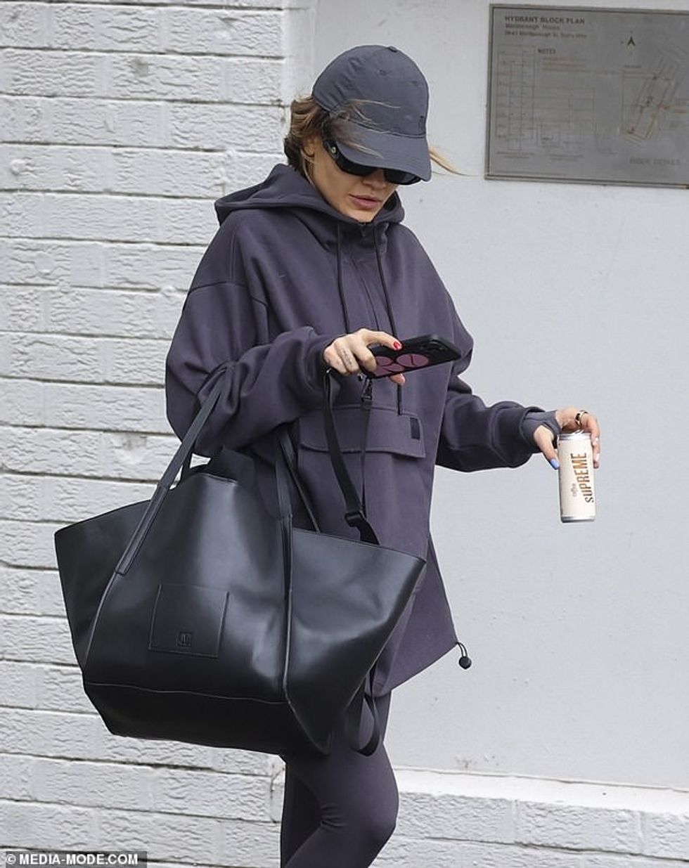 71449563 12128623 She finished her look with tie dyed socks in shades of red orang a 20 1685111889636