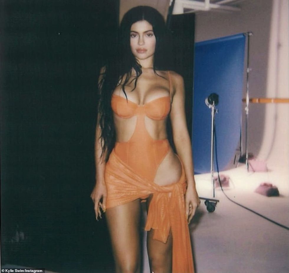 72338855 12215409 Another look at the same suit Jenner seems to love wearing orang a 23 1687283837690