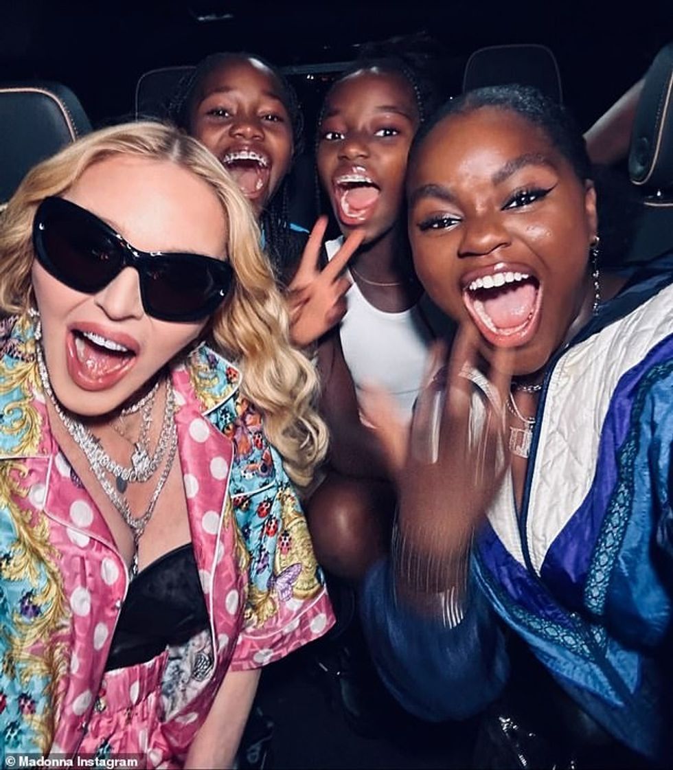 73851219 12361833 Ecstatic Madonna and three of her daughters showed their excitem a 2 1690917403287