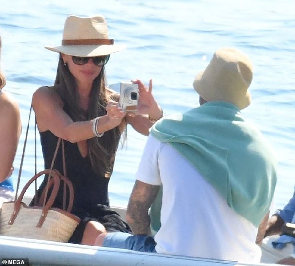 74391007 12413901 Say cheese Victoria made sure to grab a snap of her hubby in his m 42 1692204981166