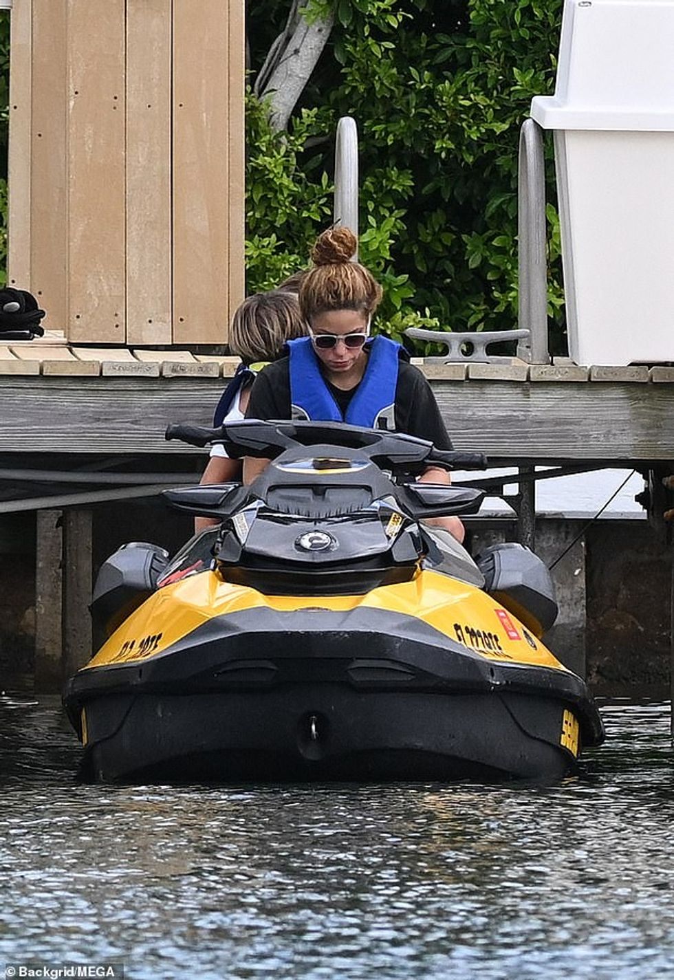 75056061 12480273 Comfortable She wore her wavy hair pulled back into a bun a 18 1693866550240