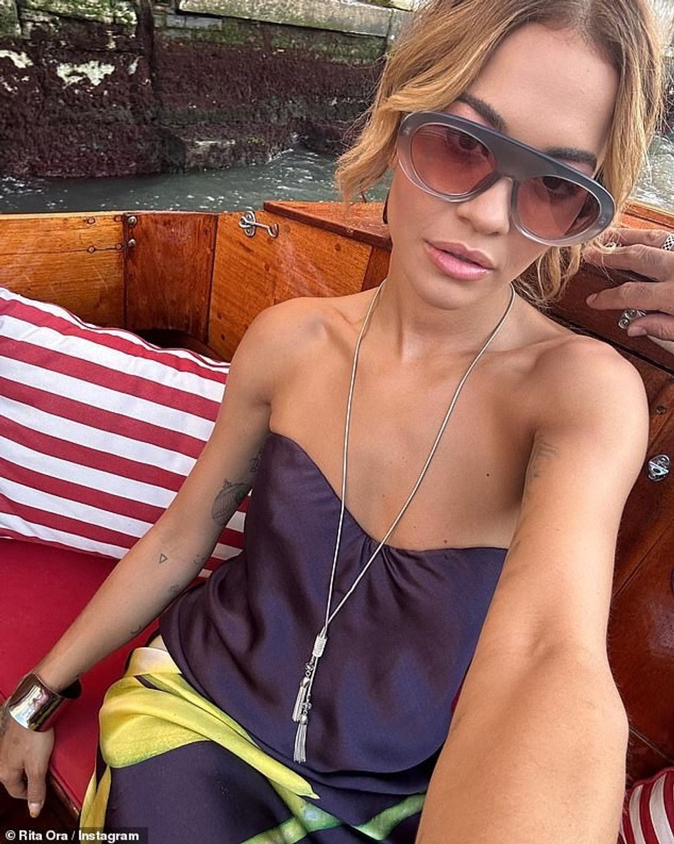 75068375 12481549 Shady lady Rita shared another photo in a silk strapless number a 22 1693900154755