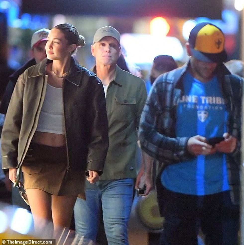 76257595 12603333 Radiant Her locks were worn in a slicked back bun and she sporte a 5 1696629767163