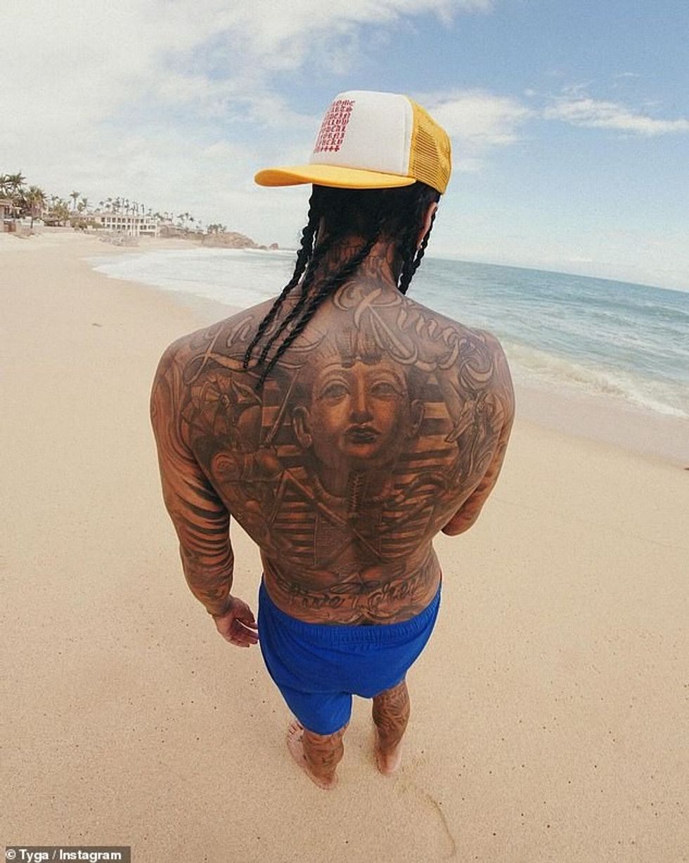 76914839 12664319 Showing off his tattoos Another photo showed Tyga posing on the a 5 1698109716902