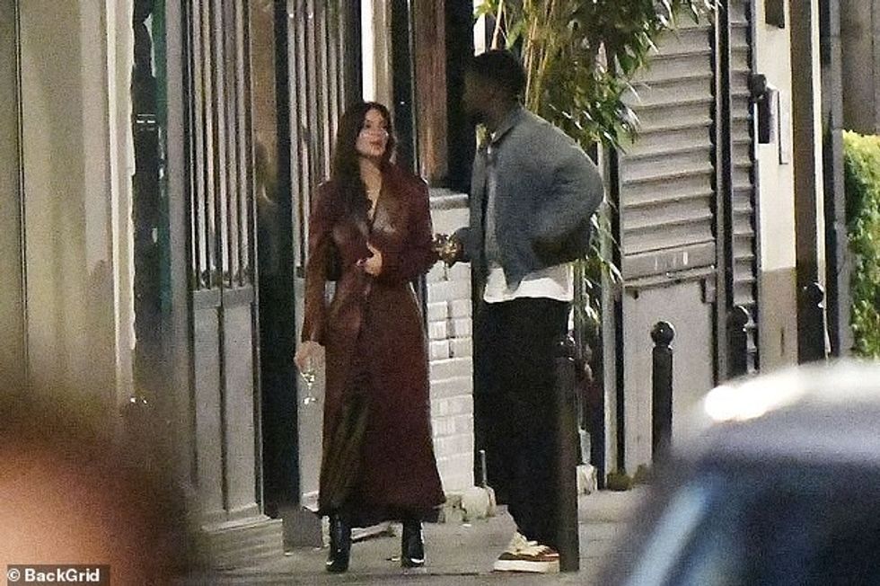 76997209 12672255 Fun The pair carried some glasses of wine as they stepped out in a 304 1698263246152