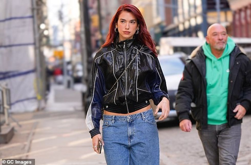 78385393 12806131 Dua Lipa 28 stunned in low rise jeans as she stepped out of her m 3 1701290973749