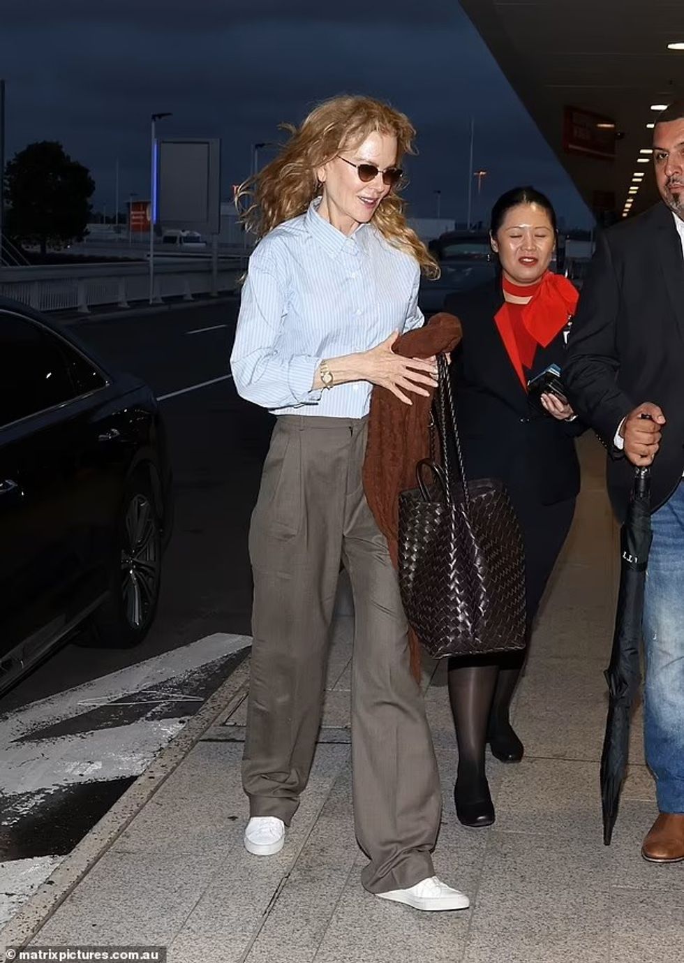 79607889 12925847 She carried a brown sweater for her j