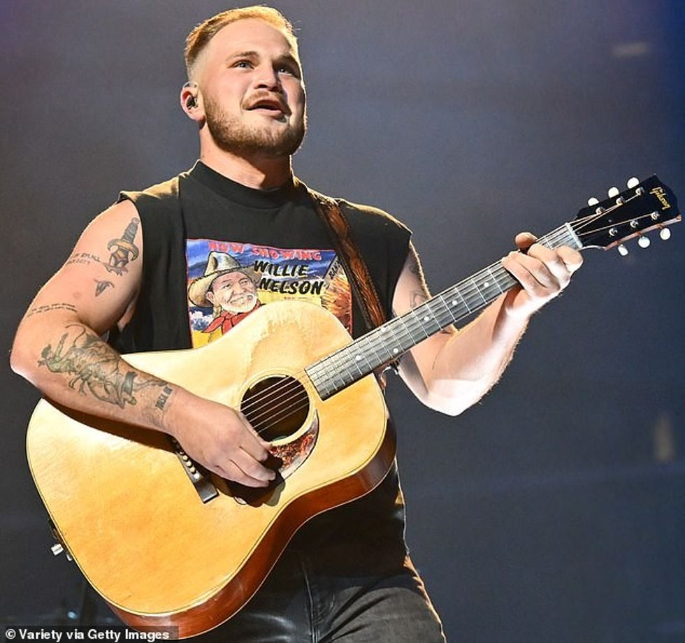 92177819 14141331 Zach Bryan swore at the audience after an object was thrown at h m 5 1732902799597